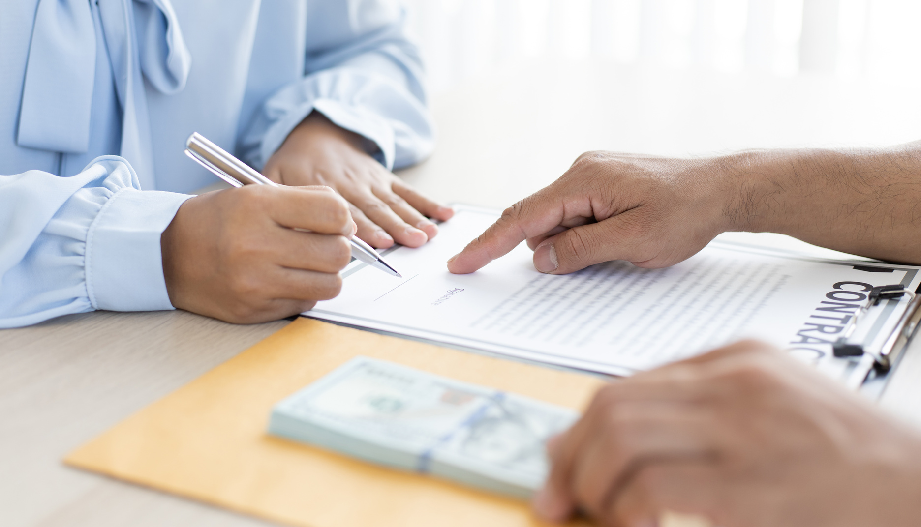Person Signing a Contract